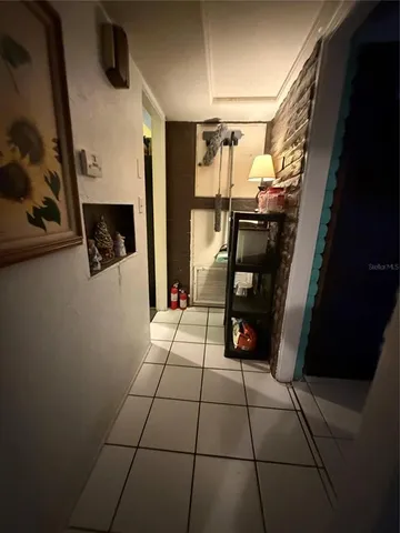 a bed room with a bed and a lamp