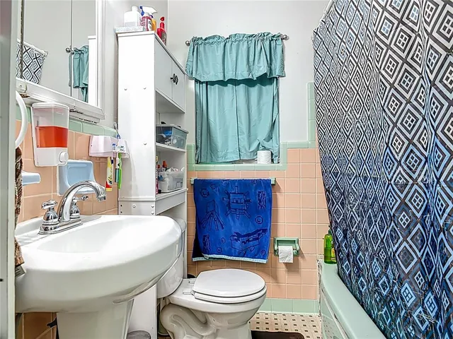 a bedroom with a bed and cabinets