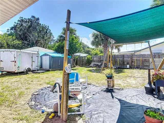 a view of a backyard with sitting area