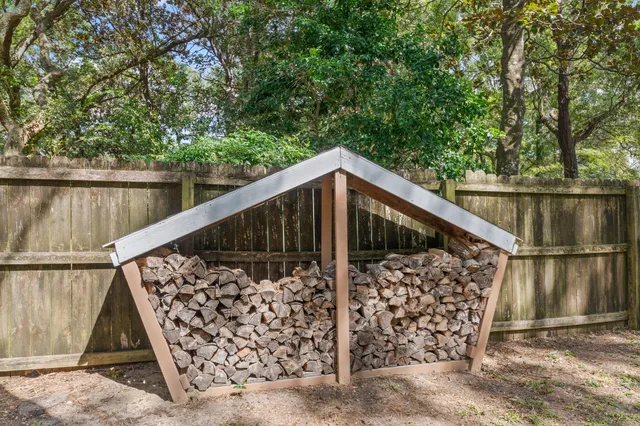 a view of balcony with wooden fence