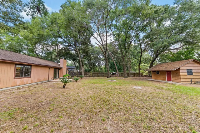 a house with trees in the background