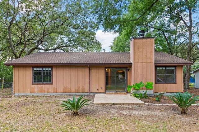 a front view of a house with a yard and a garage