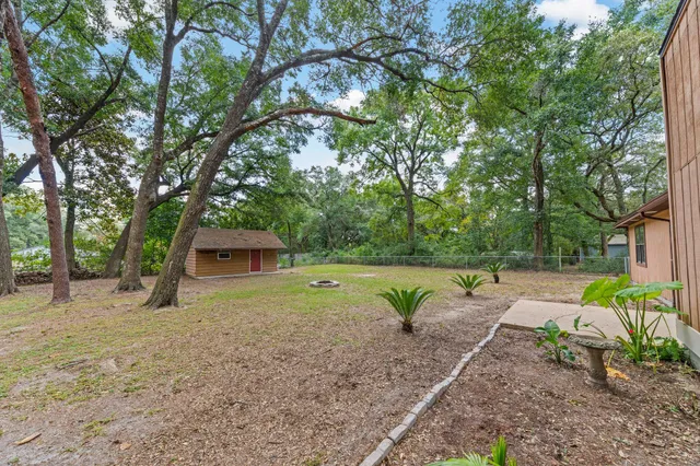 a house with trees in the background