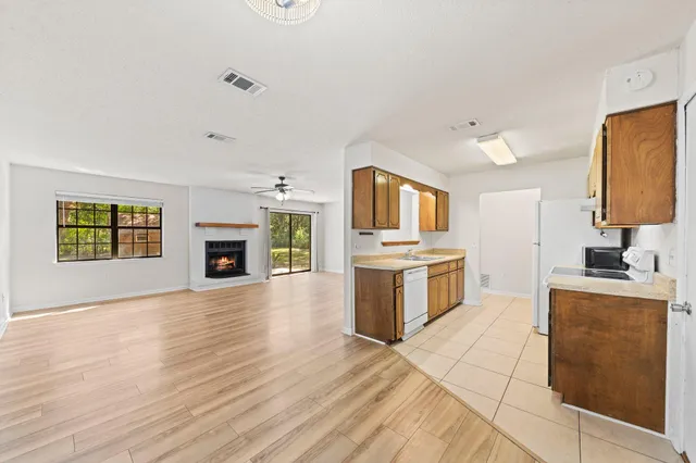a kitchen with granite countertop a stove top oven and sink