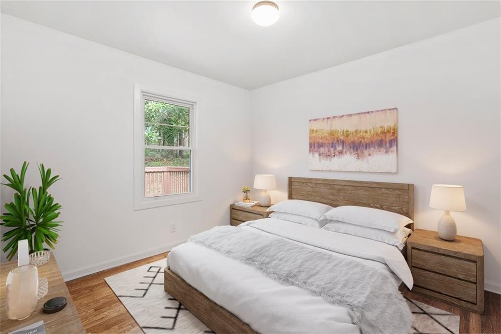 3406 Jackson Drive Decatur, GA 30032 - Photo 14 of 28 a bedroom with a bed and a potted plant