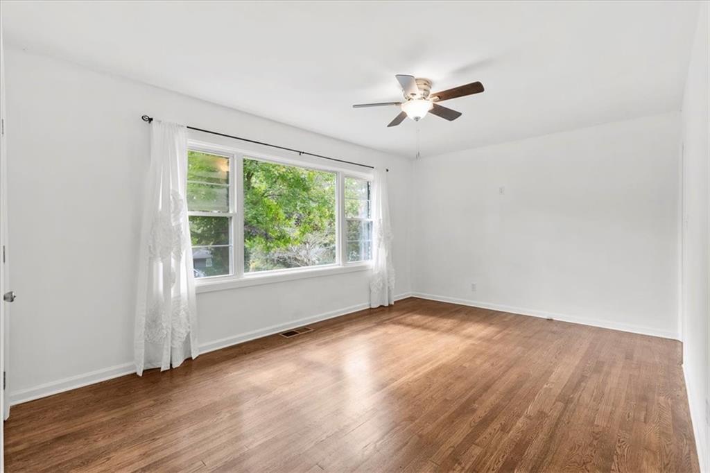 3406 Jackson Drive Decatur, GA 30032 - Photo 5 of 28 a view of empty room with wooden floor and fan
