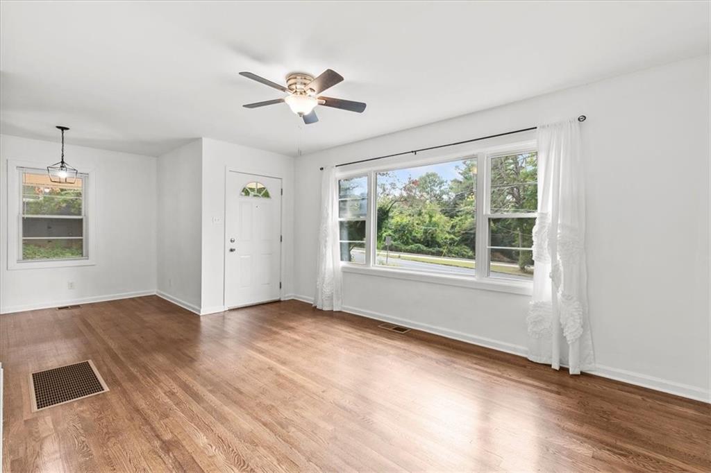 3406 Jackson Drive Decatur, GA 30032 - Photo 7 of 28 a view of an empty room with a window and wooden floor
