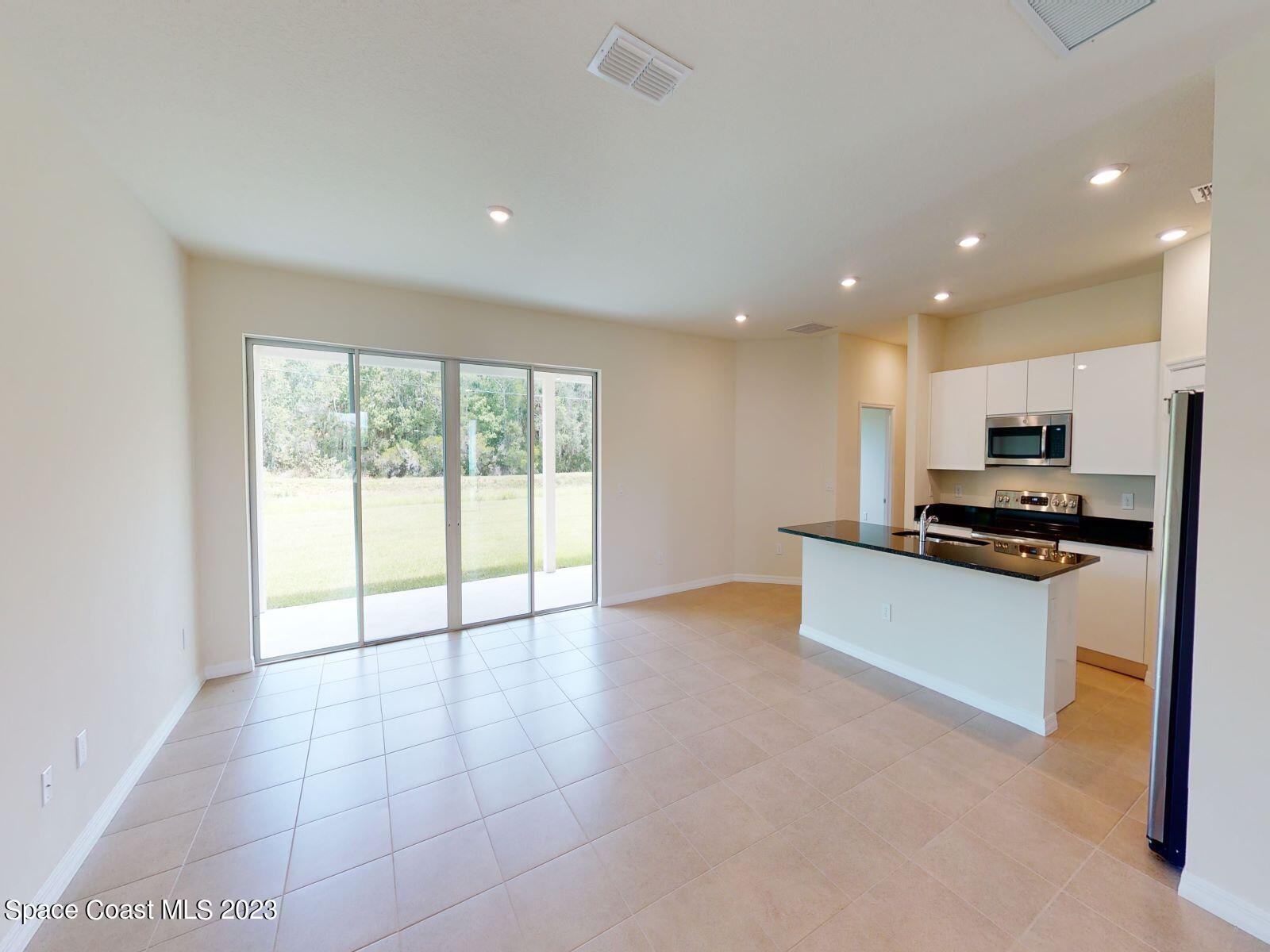 467 Scarlet Road Southwest Palm Bay, FL 32908 - Photo 4 of 18 005_Family Room Kitchen