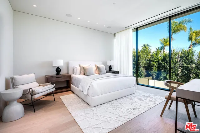 a bedroom with a bed and a couch