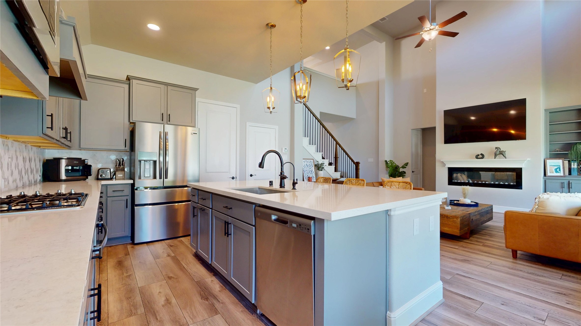 8305 Greenleaf Ridge Way Conroe, TX 77385 - Photo 10 of 33 a kitchen with kitchen island a sink appliances and cabinets