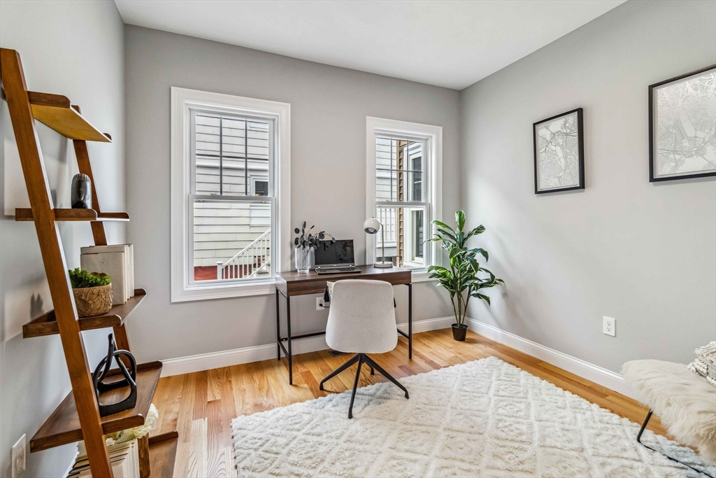 16 Alston Street, Unit 16 Somerville, MA 02143 - Photo 15 of 39 a work room with furniture and a window