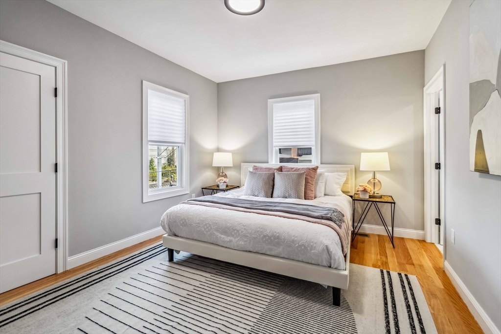 16 Alston Street, Unit 16 Somerville, MA 02143 - Photo 16 of 39 a bedroom with a bed and a window