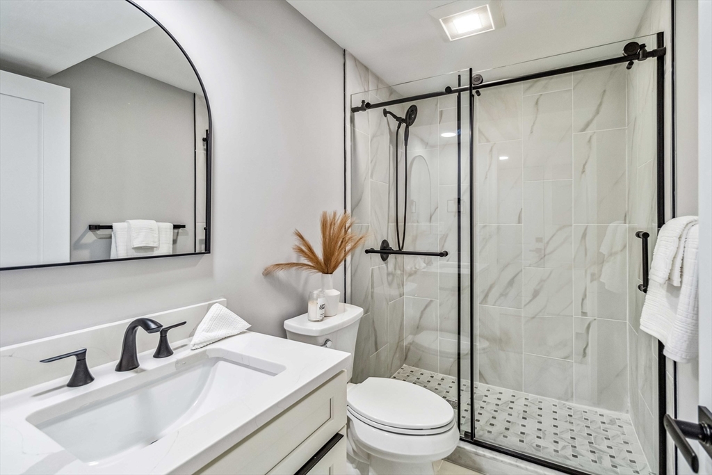 16 Alston Street, Unit 16 Somerville, MA 02143 - Photo 19 of 39 a bathroom with a sink toilet and shower