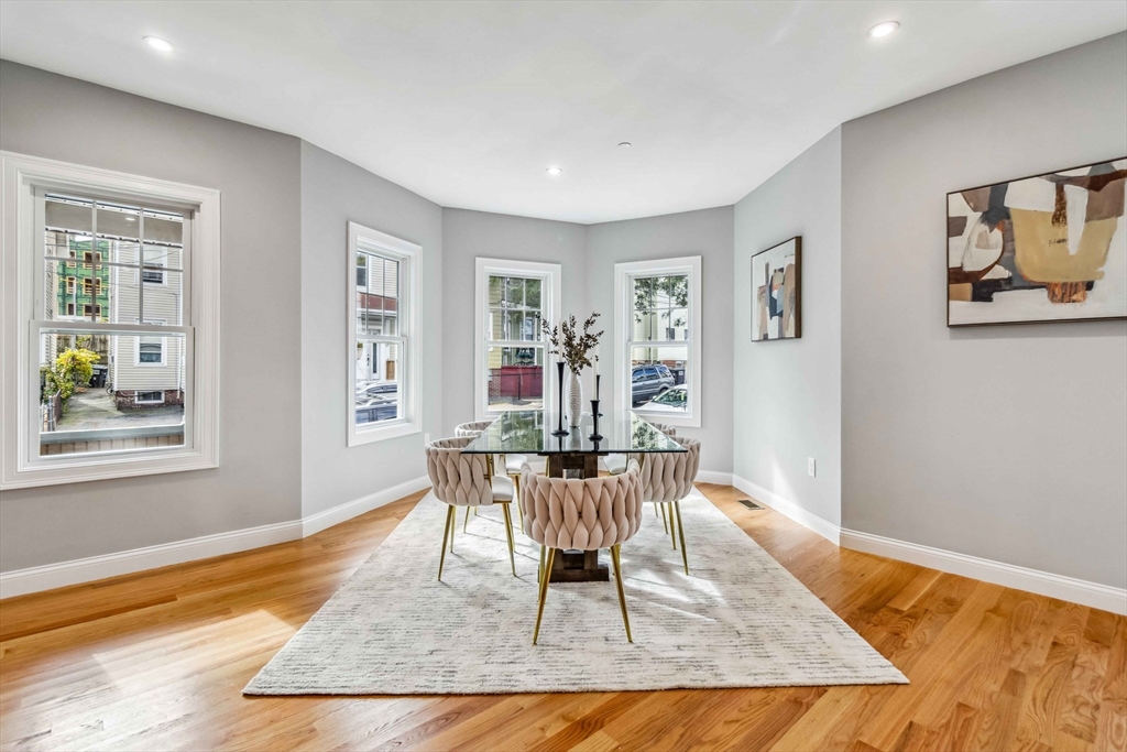 16 Alston Street, Unit 16 Somerville, MA 02143 - Photo 3 of 39 a dining room with wooden floor and window
