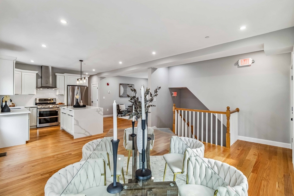 16 Alston Street, Unit 16 Somerville, MA 02143 - Photo 4 of 39 a view of a living room kitchen and a wooden floor