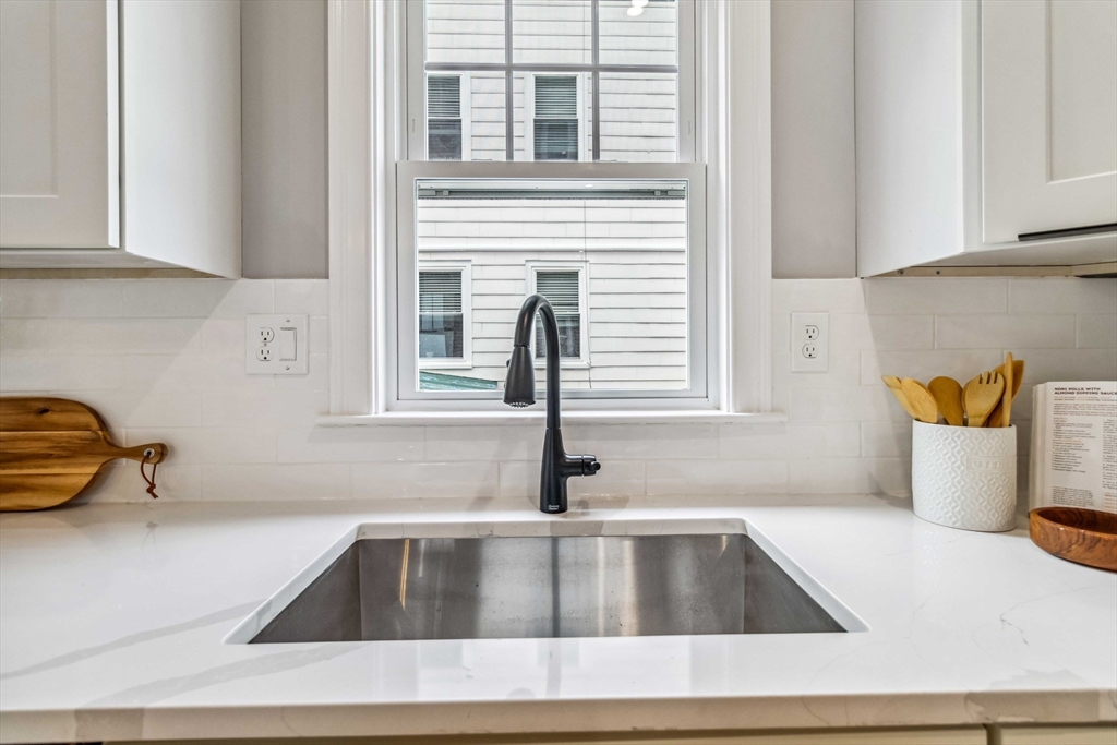 16 Alston Street, Unit 16 Somerville, MA 02143 - Photo 9 of 39 a kitchen with a sink and a window