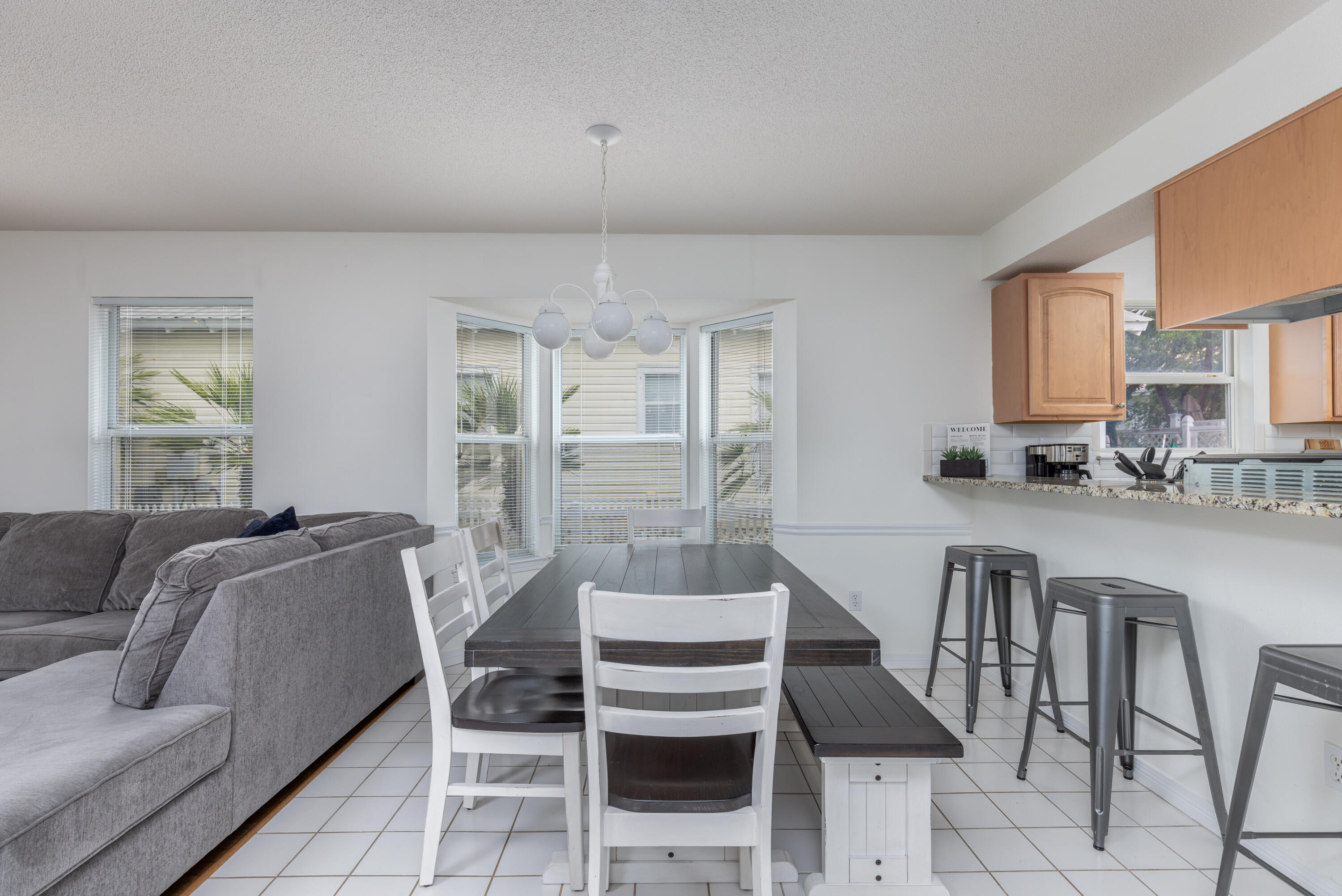 4450 Ocean View Drive Destin, FL 32541 - Photo 19 of 34 a living room with furniture and a chandelier