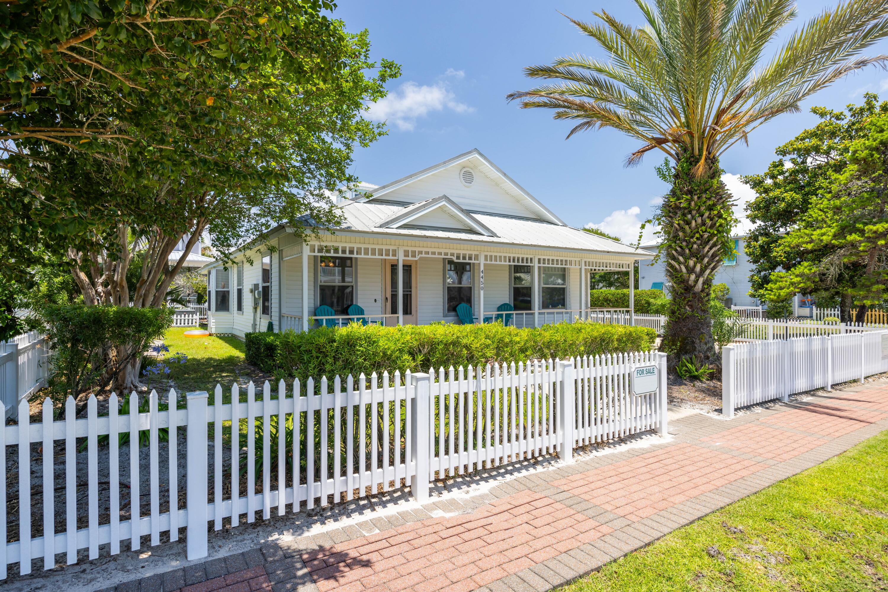 4450 Ocean View Drive Destin, FL 32541 - Photo 2 of 34 a front view of a house with a garden