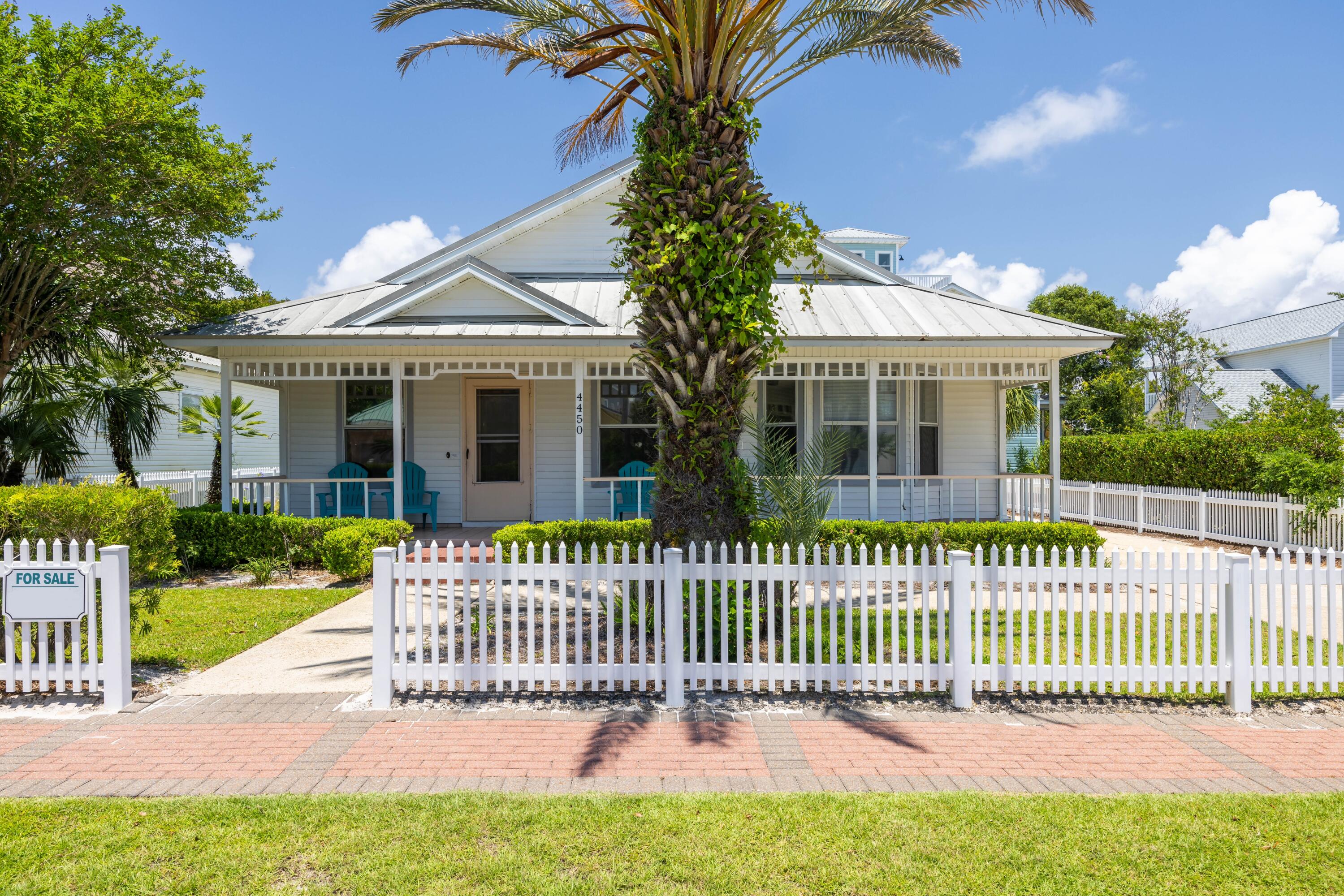 4450 Ocean View Drive Destin, FL 32541 - Photo 5 of 34 a front view of a house with a garden and deck