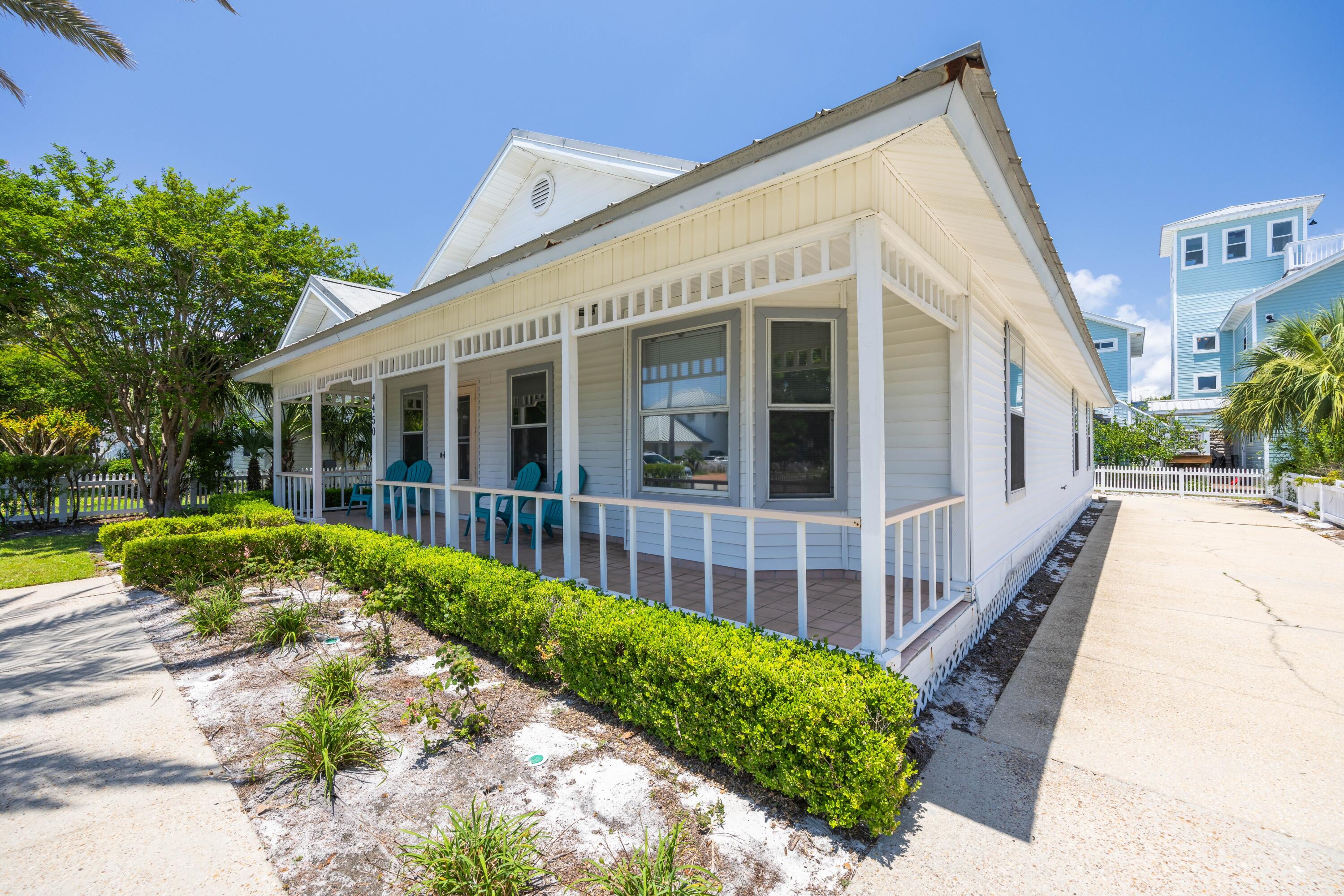 4450 Ocean View Drive Destin, FL 32541 - Photo 10 of 34 a view of a house with a yard and potted plants