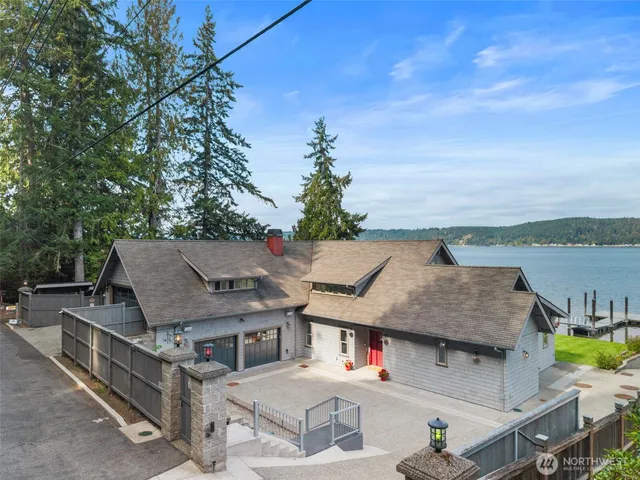 an aerial view of a house with a garden and outdoor seating