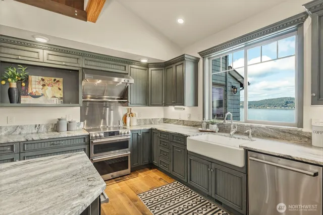 a spacious bedroom with a large bed and a large window