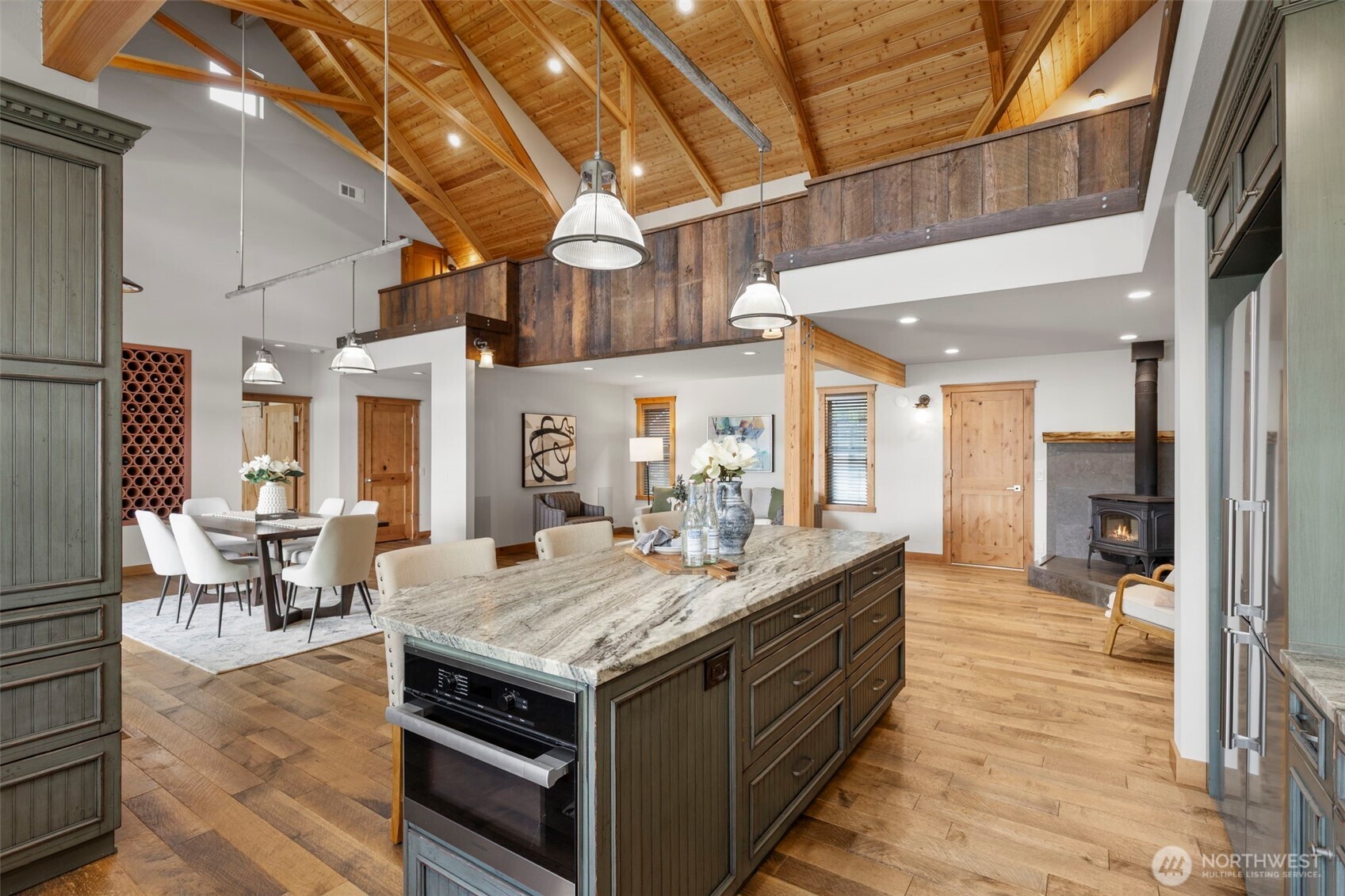 14341 Highway 106 Belfair, WA 98528 - Photo 12 of 40 a kitchen with a stove and chairs