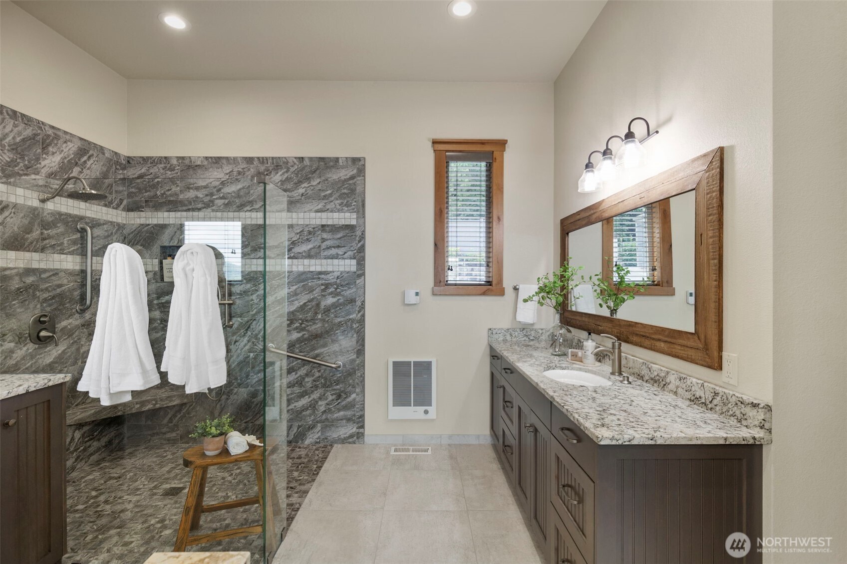 14341 Highway 106 Belfair, WA 98528 - Photo 15 of 40 a bathroom with a granite countertop sink and a mirror