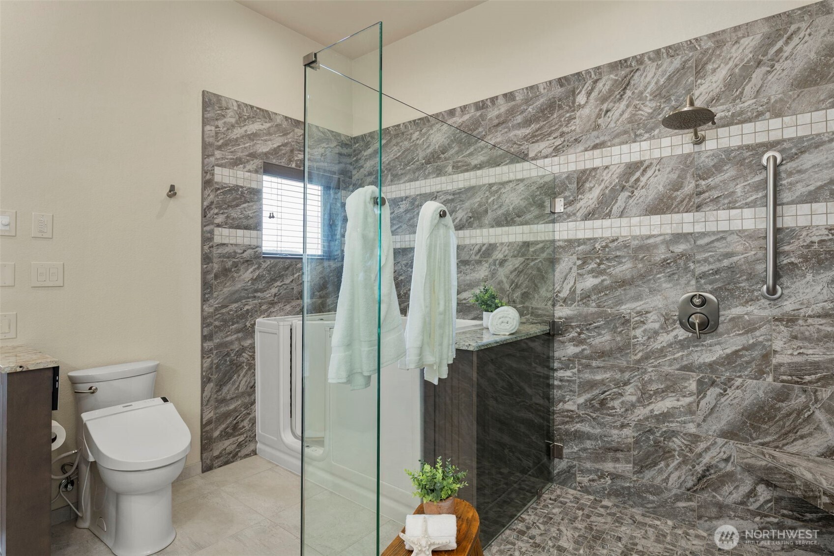 14341 Highway 106 Belfair, WA 98528 - Photo 16 of 40 a bathroom with a toilet and shower