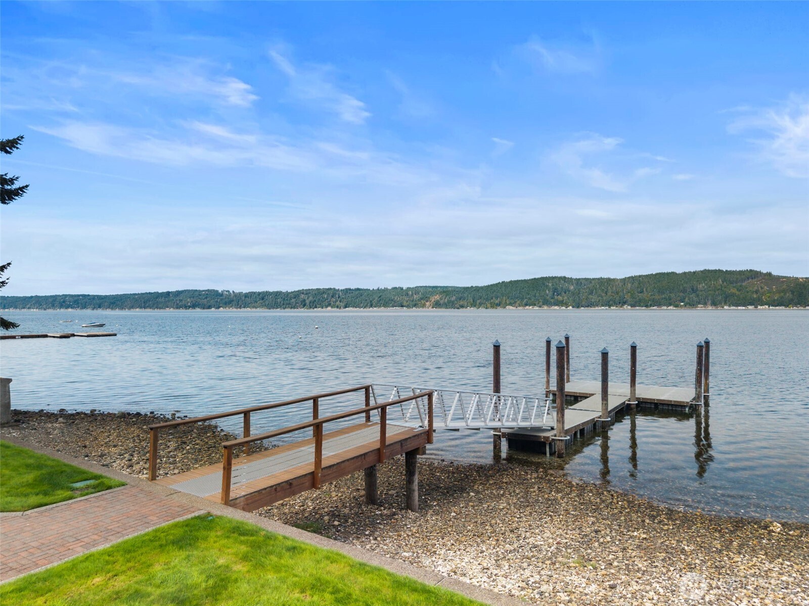 14341 Highway 106 Belfair, WA 98528 - Photo 2 of 40 a view of a lake with outdoor seating and lake