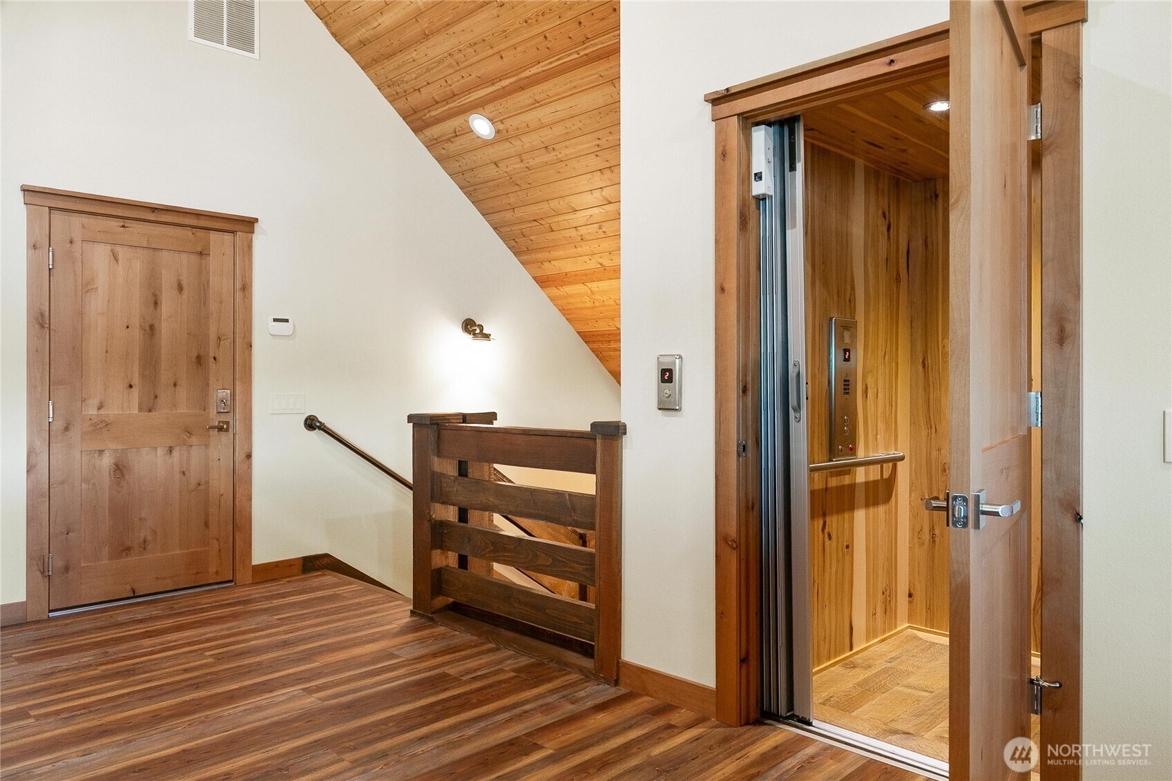 14341 Highway 106 Belfair, WA 98528 - Photo 23 of 40 a view of a hallway with wooden floor and staircase