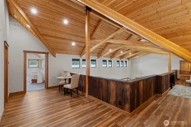 a bedroom with a large bed and a couch