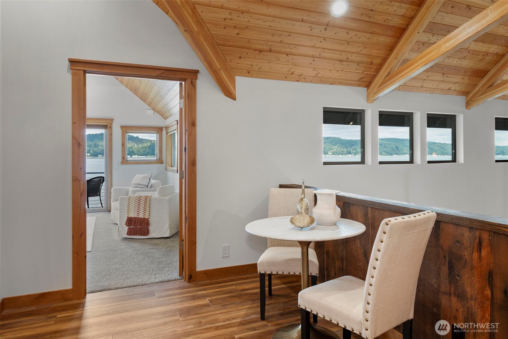 14341 Highway 106 Belfair, WA 98528 - Photo 25 of 40 a view of a dining room with furniture and wooden floor