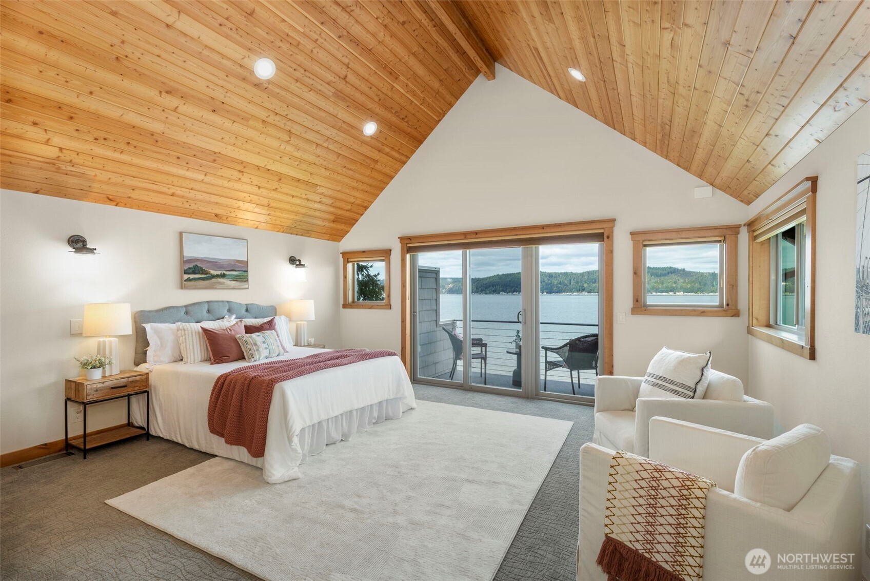 14341 Highway 106 Belfair, WA 98528 - Photo 27 of 40 a bedroom with a large bed and a couch