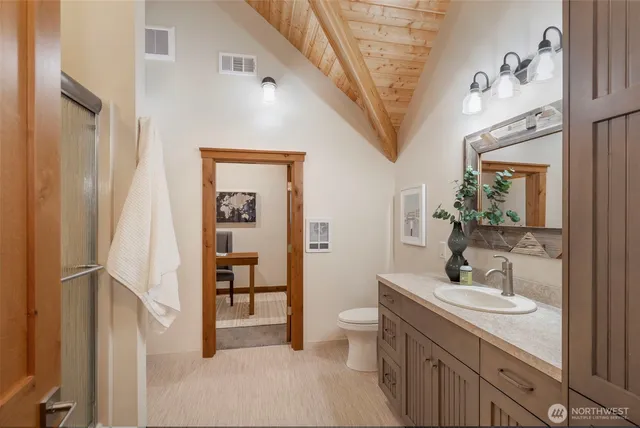 an aerial view of a house with a swimming pool