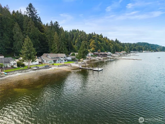 an aerial view of a house with a lake view