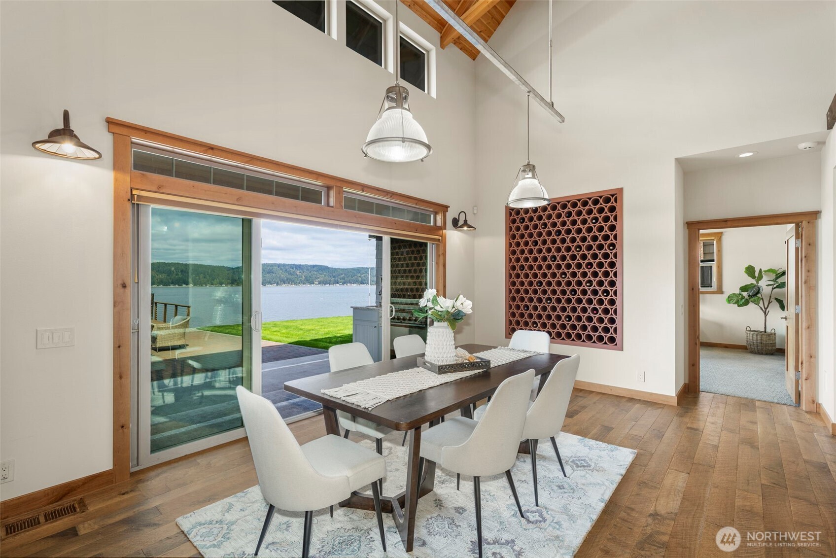 14341 Highway 106 Belfair, WA 98528 - Photo 6 of 40 a view of a dining room with furniture window and wooden floor