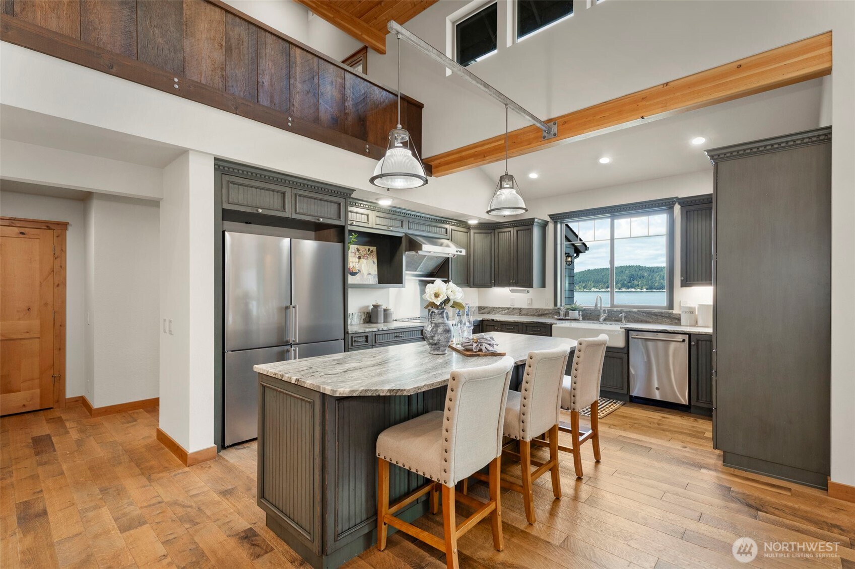 14341 Highway 106 Belfair, WA 98528 - Photo 9 of 40 a dining hall with stainless steel appliances kitchen island granite countertop furniture and a kitchen view