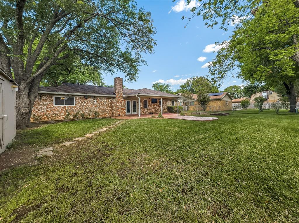 220 Cooper Drive Hurst, TX 76053 - Photo 25 of 27 a view of house with a yard
