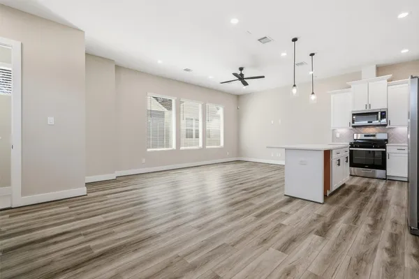 a kitchen with a stove and a microwave