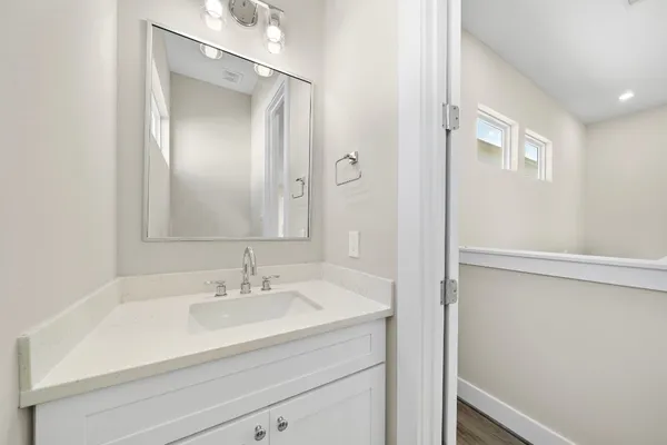 an empty room with closet and wooden floor