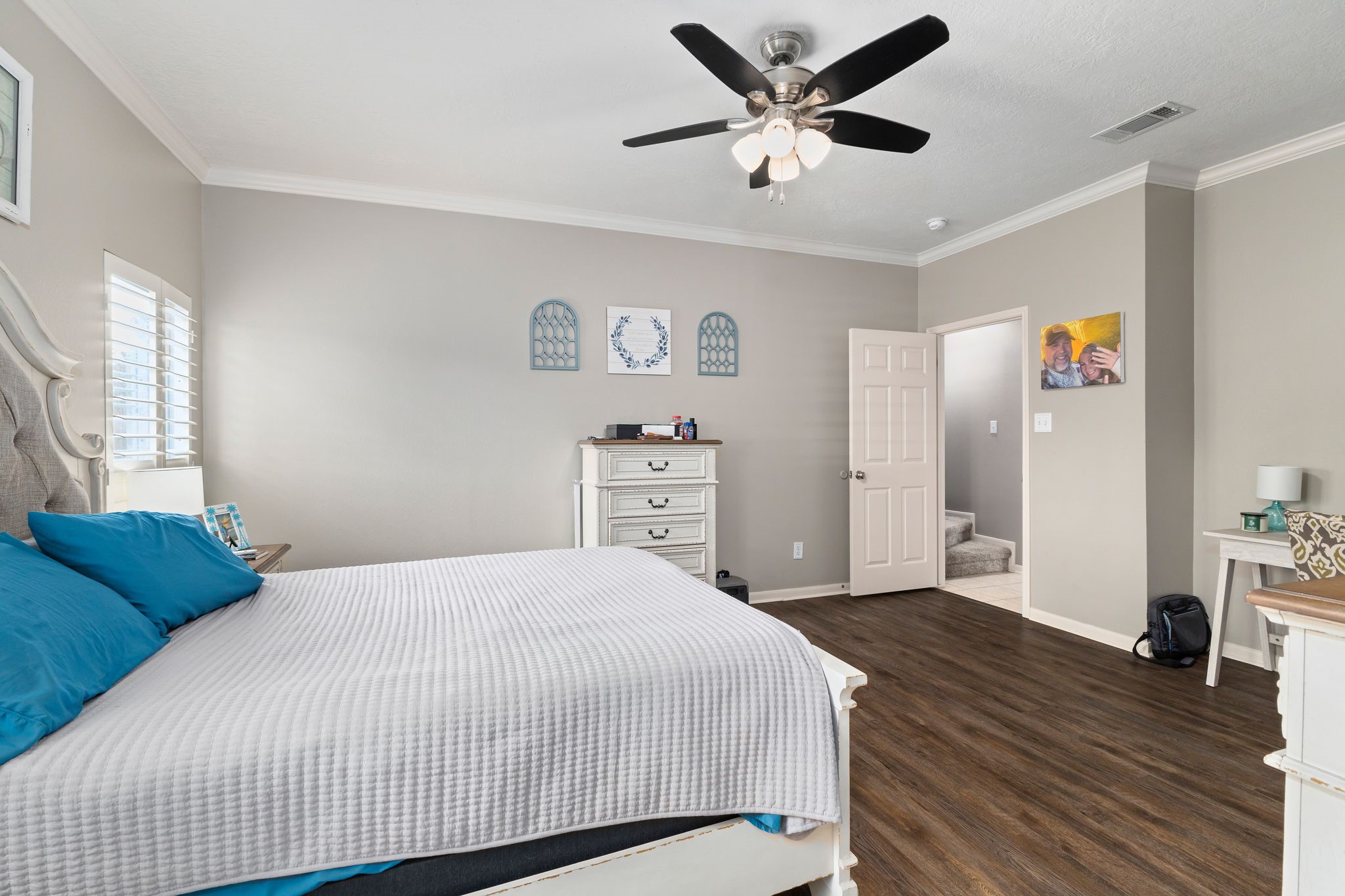 2709 Chase Street Brenham, TX 77833 - Photo 17 of 43 a bedroom with a bed and a wooden floor