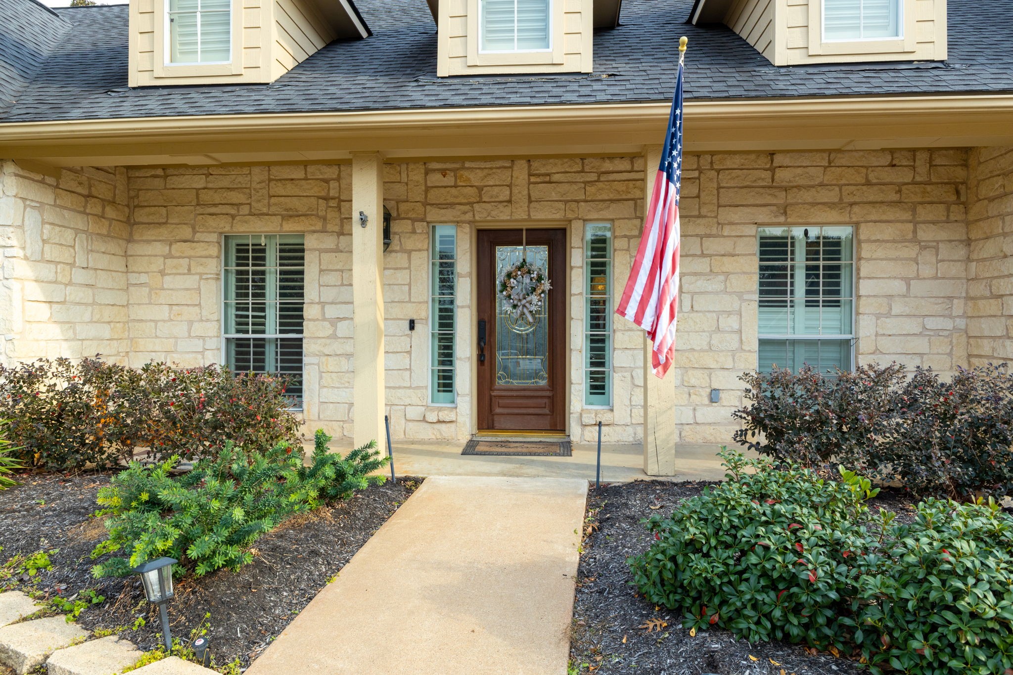 2709 Chase Street Brenham, TX 77833 - Photo 2 of 43 front view of a brick house with a large windows