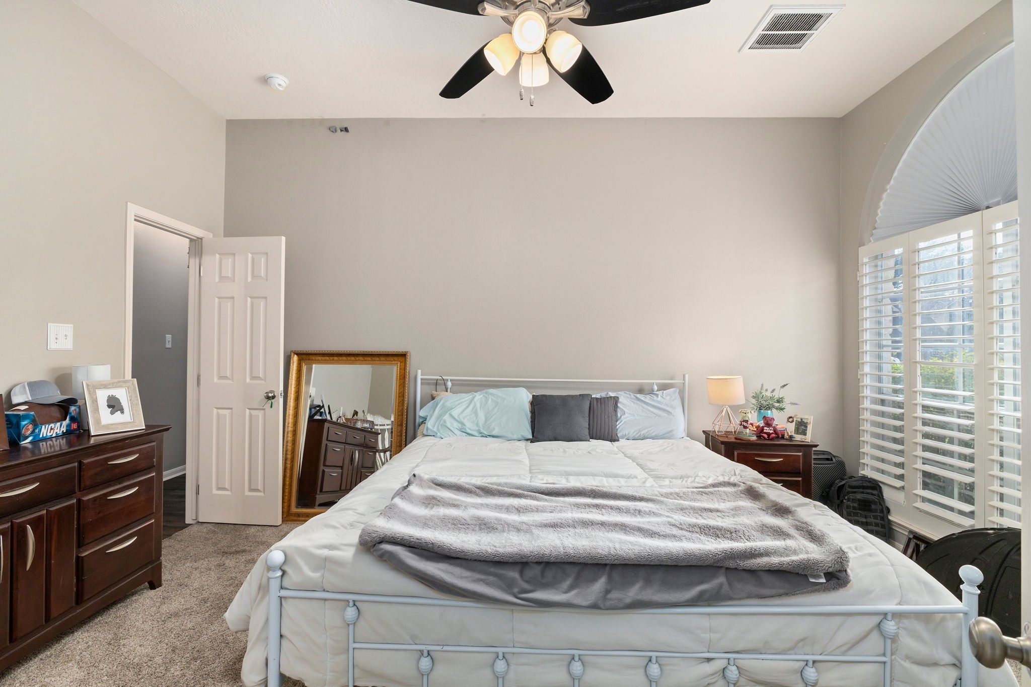 2709 Chase Street Brenham, TX 77833 - Photo 25 of 43 a spacious bedroom with a bed and a dresser
