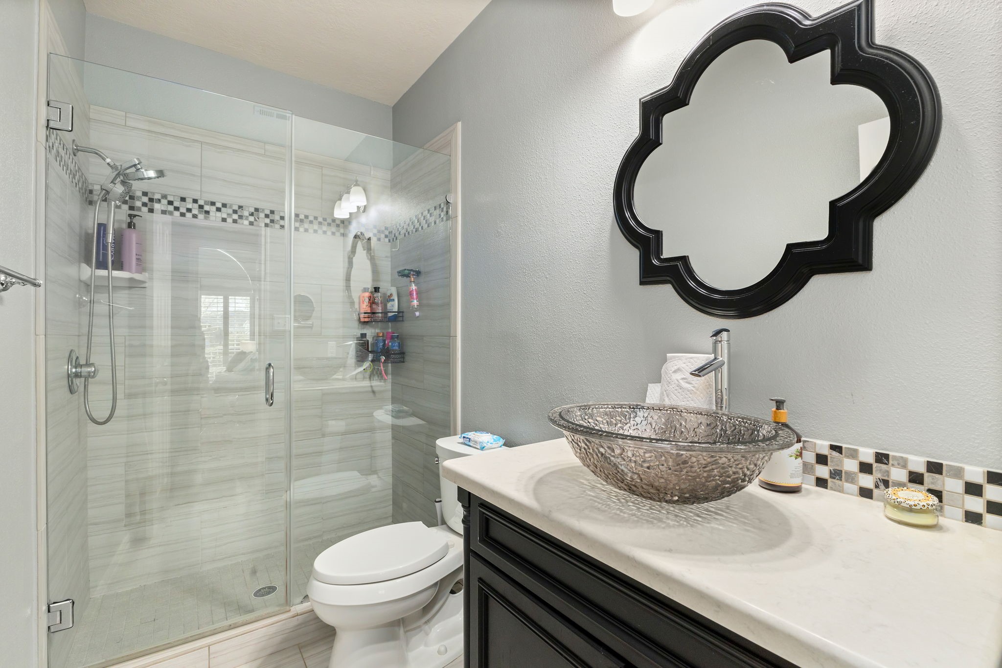 2709 Chase Street Brenham, TX 77833 - Photo 26 of 43 a bathroom with a sink a toilet and shower
