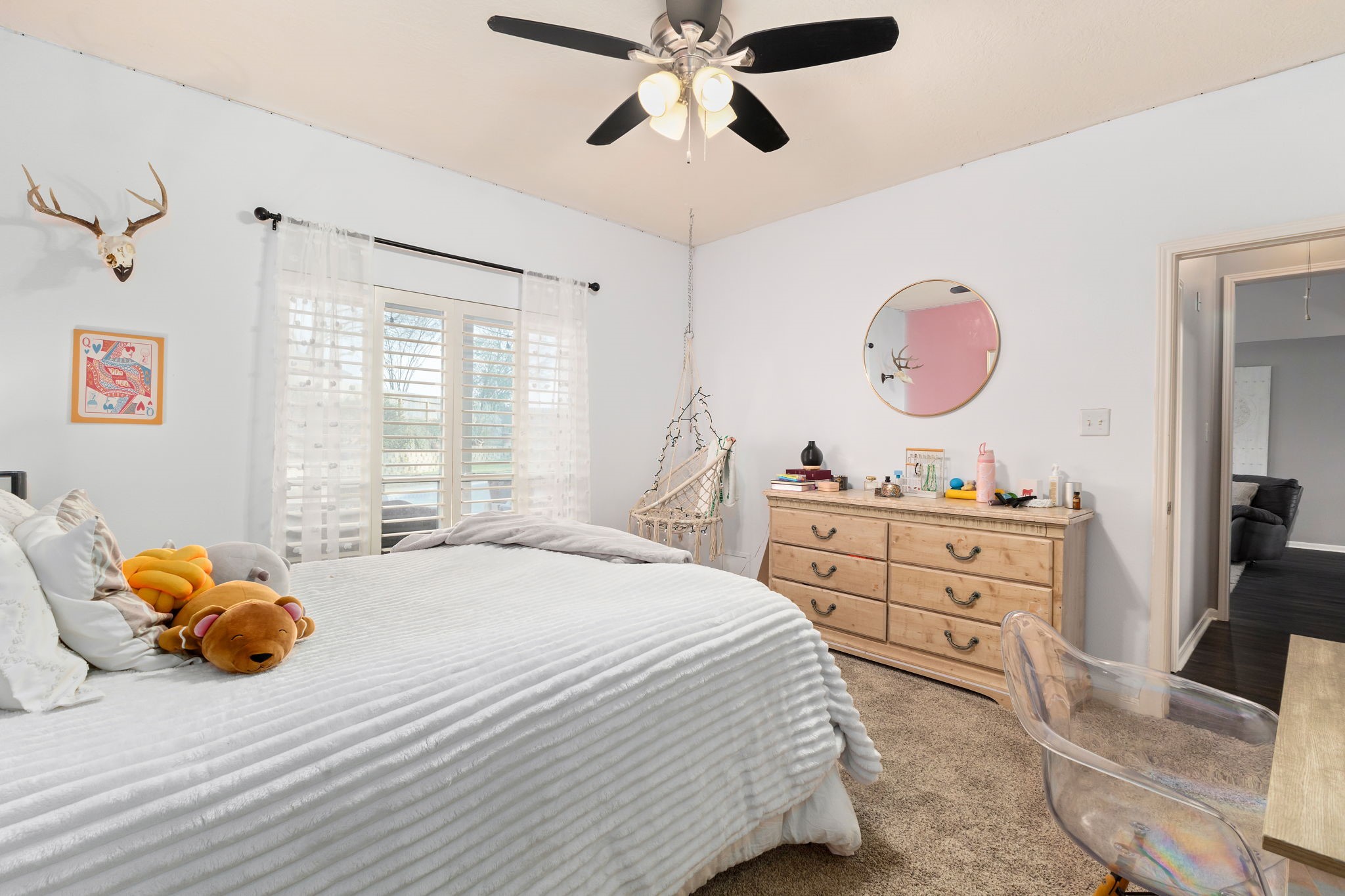 2709 Chase Street Brenham, TX 77833 - Photo 28 of 43 a bedroom with a bed and a chandelier