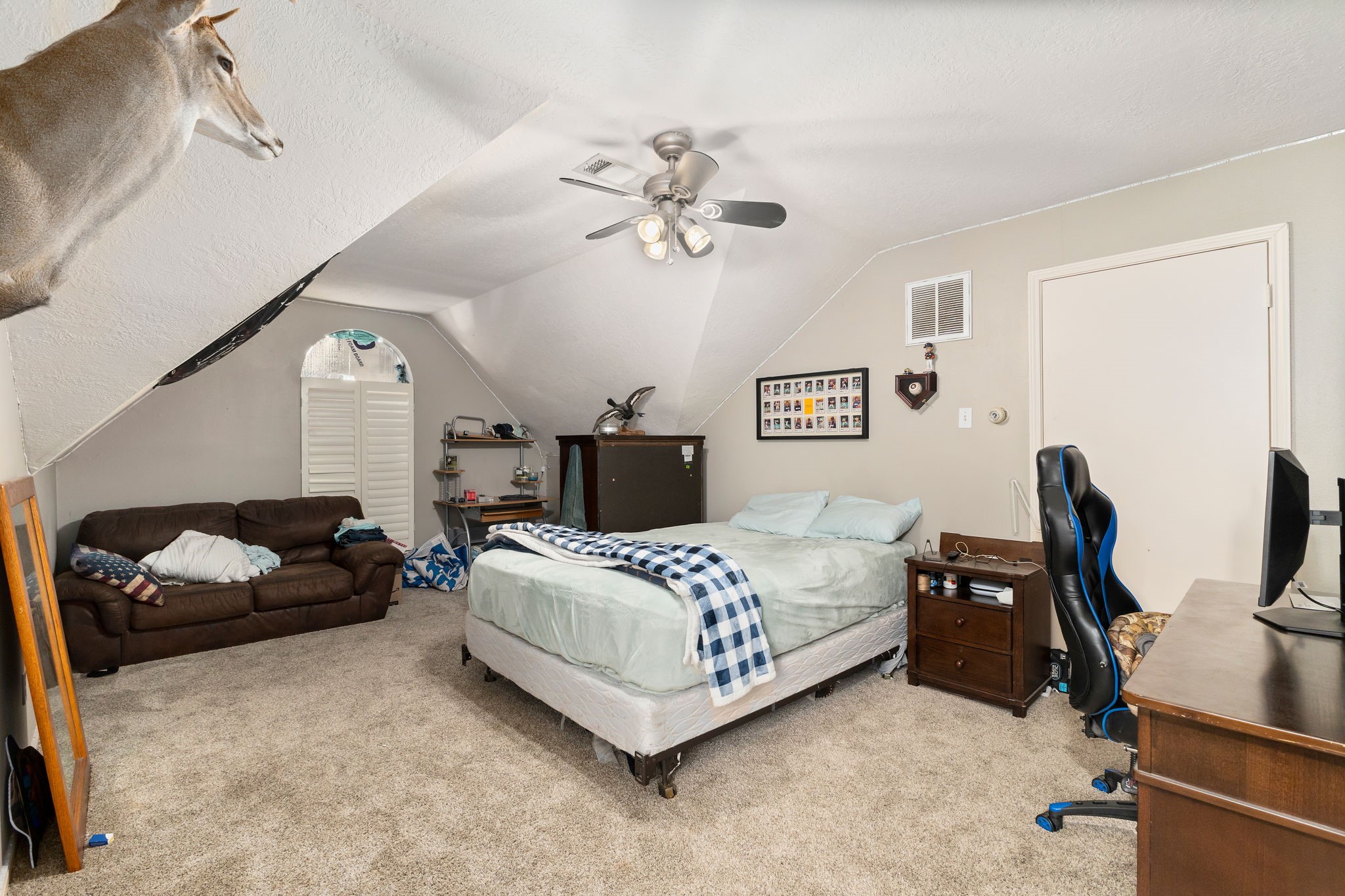 2709 Chase Street Brenham, TX 77833 - Photo 31 of 43 a bedroom with a bed gym equipment and a desk