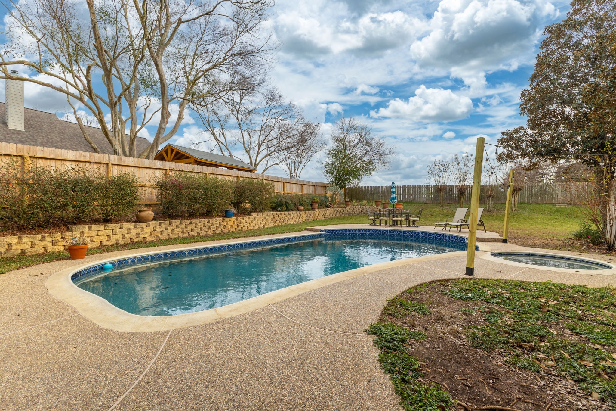 2709 Chase Street Brenham, TX 77833 - Photo 33 of 43 a view of a swimming pool with a yard