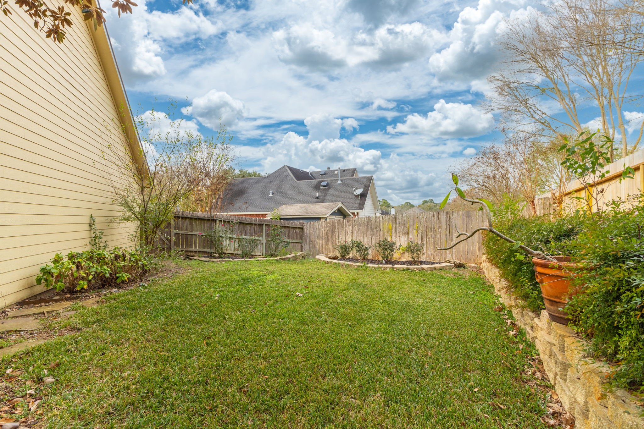2709 Chase Street Brenham, TX 77833 - Photo 35 of 43 a view of a house with a big yard and garden