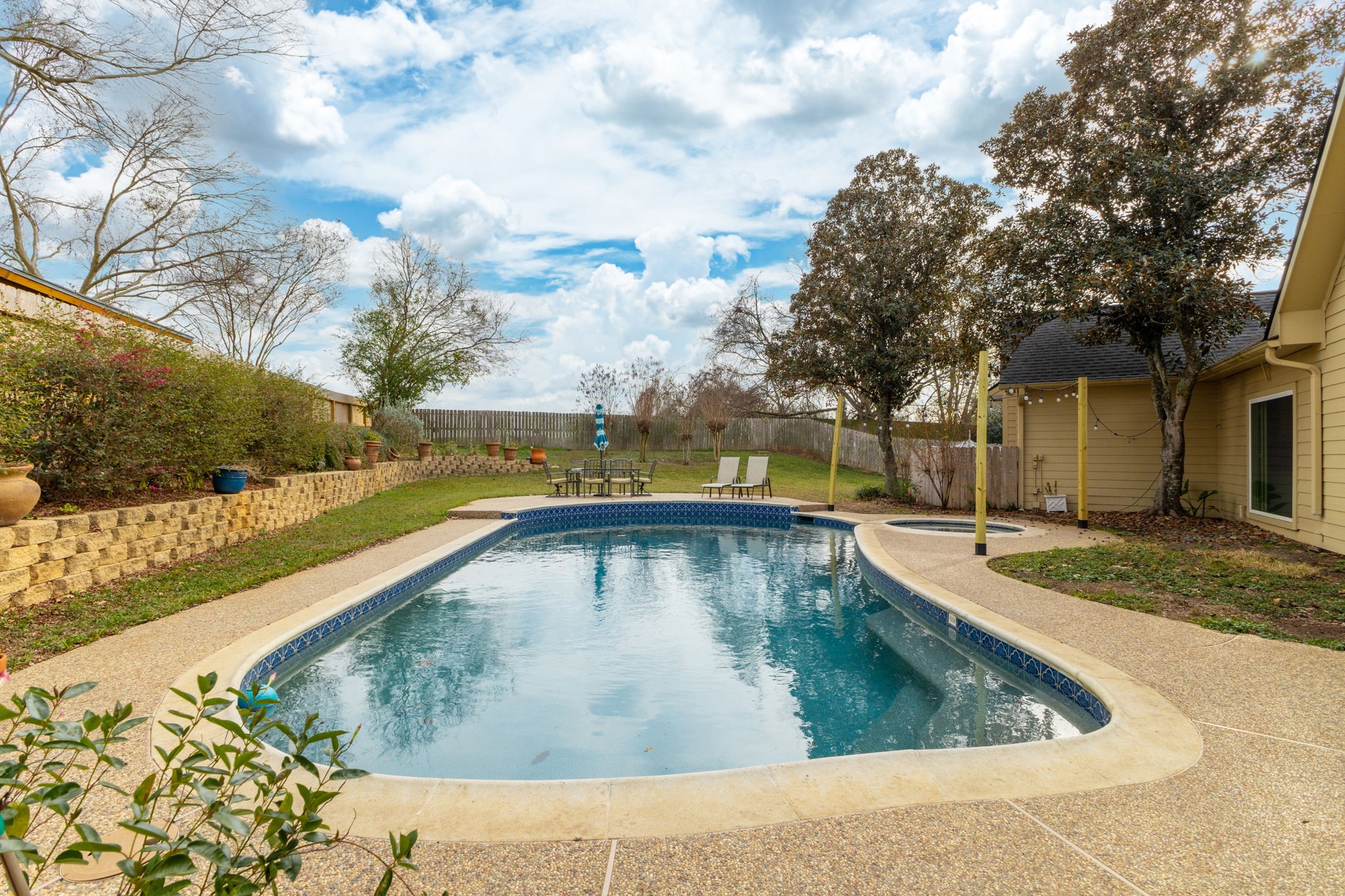 2709 Chase Street Brenham, TX 77833 - Photo 37 of 43 a view of a swimming pool with a yard